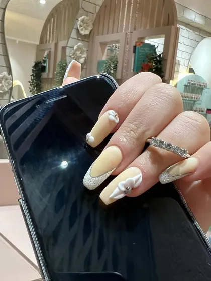 The perfect selfie-ready nails. This set combines several of our favorite techniques: 3D art, glitter, and a modern French tip.