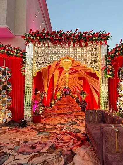 Another angle of the royal red entrance, showing the decorative mirror elements on the side panels that add extra sparkle and a modern touch to the traditional design.