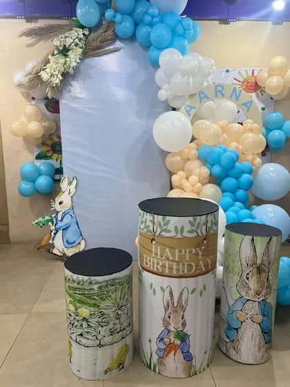 The beautifully detailed cake-cutting area for a Peter Rabbit themed party, showcasing our ability to execute classic and elegant themes.