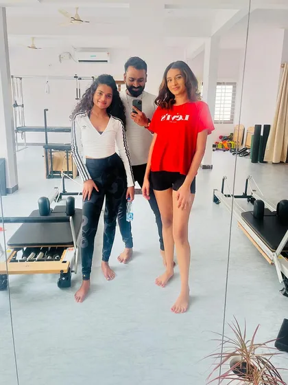 A post-workout photo with two strong young clients. Their energy is contagious.