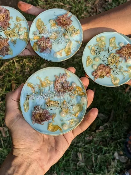 Another shot of the custom coaster set, held up to show how they look as a collection. A perfect gift for newlyweds or as wedding favors.