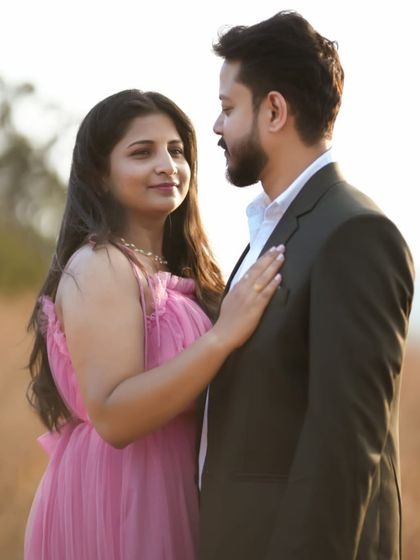 A close-up showing the connection between the couple. The soft pink of the maternity gown enhances the warm and loving feel of this photograph.