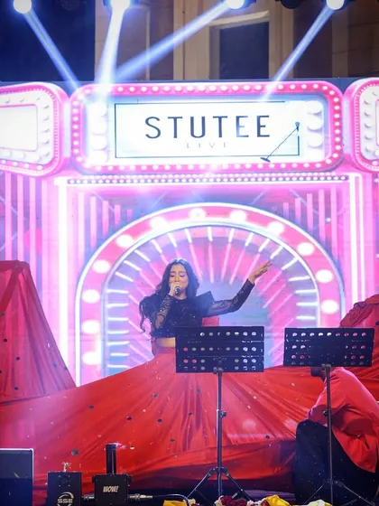 A vibrant shot from the Rotary Club event, featuring a custom stage design. My team and I can work with various stage setups to match the theme of your private party.