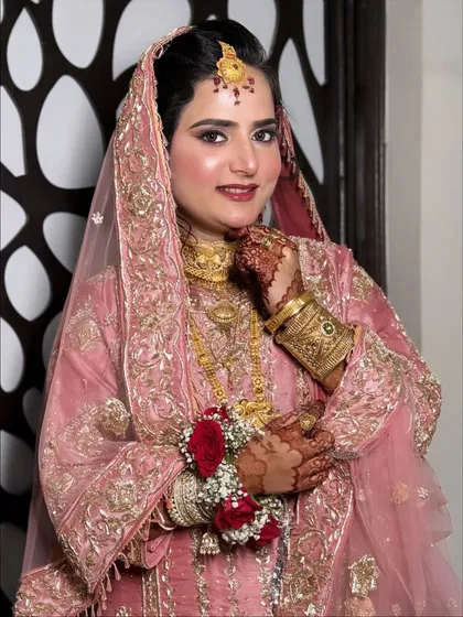 Another beautiful shot capturing the complete look, from the delicate dupatta to the intricate floral bracelets.