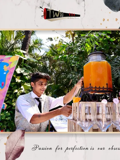 Our bartender serving up a fresh orange-based mocktail, bringing a smile and great service to the event.