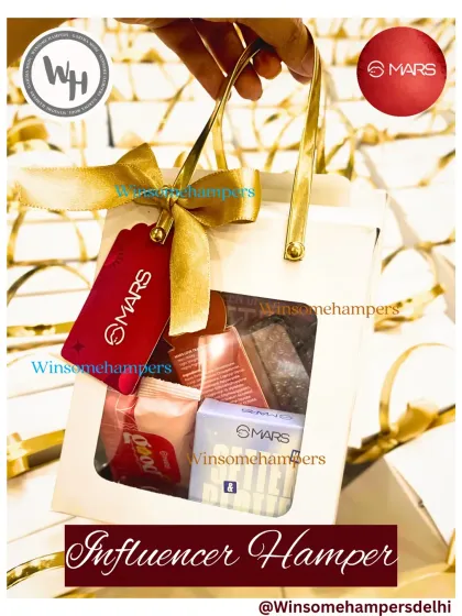 A close-up shot of a Mars Cosmetics influencer hamper being held, emphasizing its grab-and-go appeal. The design, featuring a clear window and prominent branding, is made to be seen and shared.