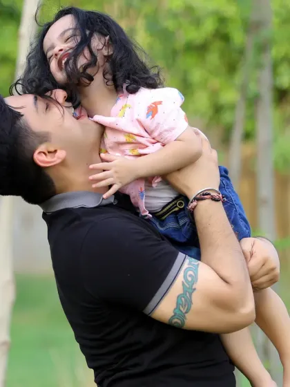 The special bond between a father and his child, captured in a beautiful, natural setting.