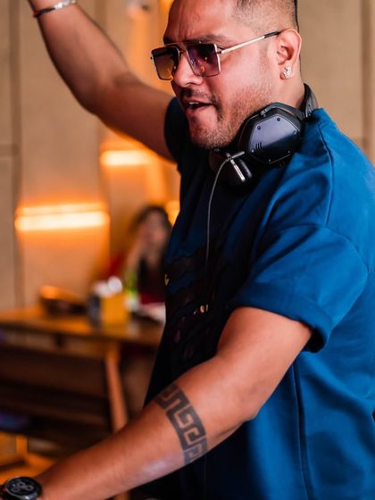 In action at Hangover. My focus is always on the music and the crowd, ensuring every night is a unique experience.