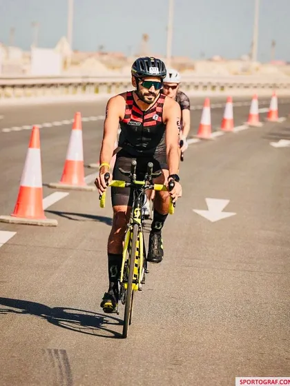 Navigating the course during the bike leg of a triathlon. Our athletes are skilled in handling their bikes in competitive, high pressure environments.