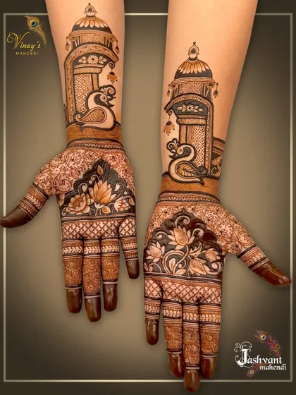 A different angle of the swan and jharokha design, showing how the artwork wraps around the hands and arms.