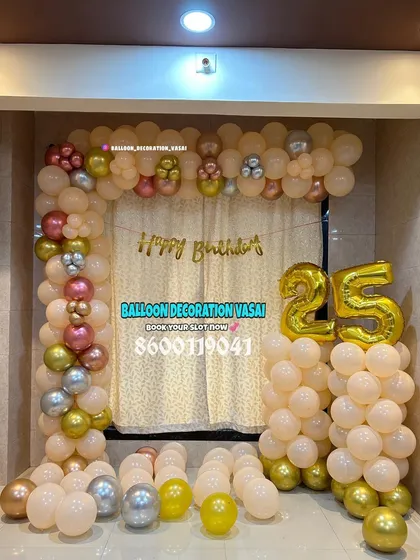 A classic square balloon arch in peach, gold, and silver tones. This setup includes large "25" foil balloons, making it perfect for a 25th birthday or anniversary party.