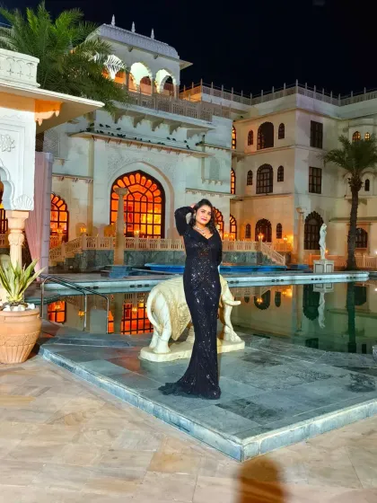 A stunning look for a grand destination wedding Sangeet at Shiv Vilas. The poolside setting at night provides a breathtaking backdrop for a glamorous celebration.