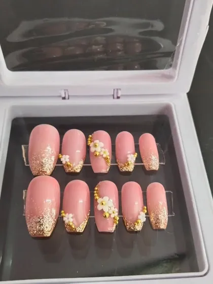 This is a closer look at one of my popular bridal sets, neatly packed and ready to go. You can see the detailed 3D floral work, gold bead accents, and glitter tips that make these nails perfect for a bride.