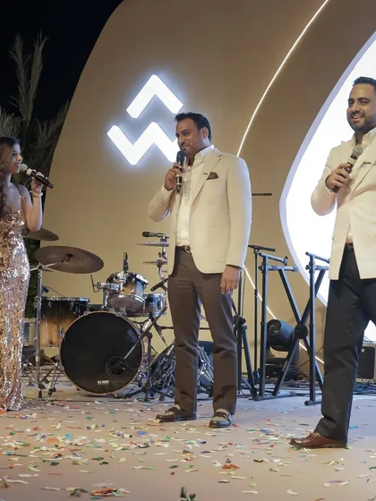 Interacting with the leadership team on stage at the WAL Developments launch event. A golden night celebrating progress and people.