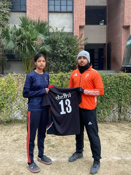 Sampada, another one of our talented players, holding her Delhi U19 jersey. We are proud to coach and develop players for every age category.