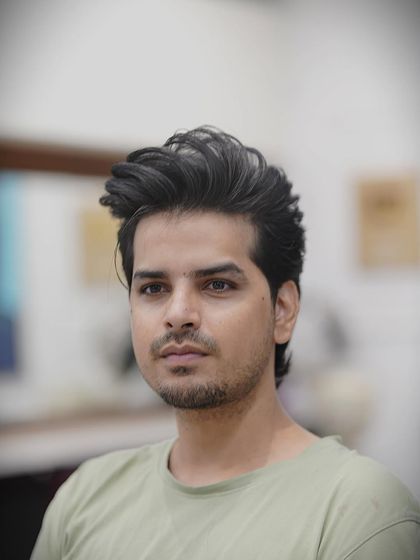 A classic short to medium length haircut for men. It's a versatile look that can be styled neatly or worn more casually.