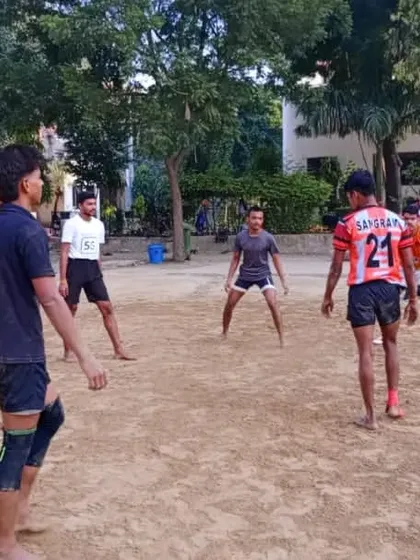 A defensive chain gets ready as a raider approaches. This picture captures the intense focus and readiness of our players during a practice session.