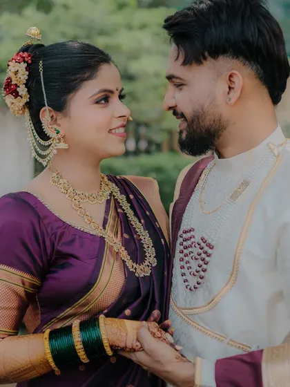 A joyful, candid moment where the couple shares a look of love and laughter. This image captures the happiness and excitement of their wedding day, showing their natural chemistry.