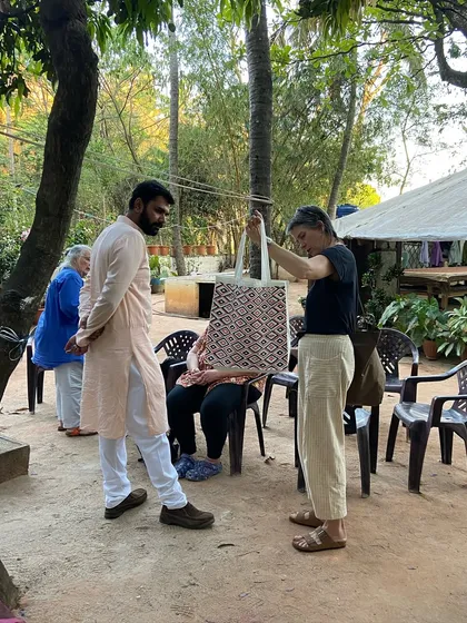 A guest at our workshop receives a finished tote bag, a memento of a day spent learning and creating. It's a joy to see our visitors take home something they've made themselves.