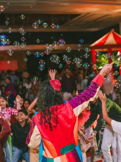 The pure joy of a bubble show. I love incorporating entertainment that captivates children, and the wonder on their faces as they reach for the bubbles is a priceless memory from this circus-themed party.
