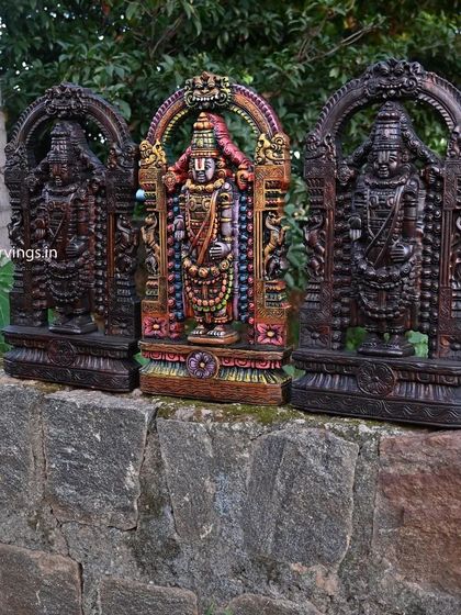 Another view of our three 24-inch Tirupati Balaji statues, showing them from a different angle against a natural backdrop.