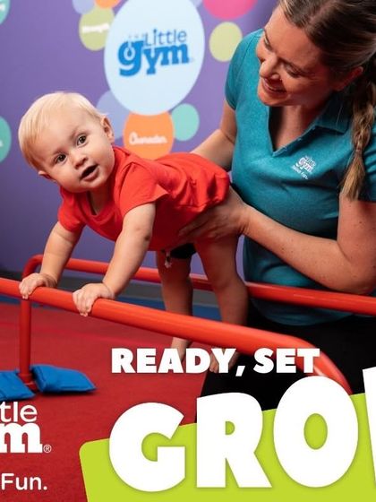 In our 'Ready, Set, Grow' theme, even our tiniest members practice foundational skills. With a parent's gentle support, this baby learns about balance and strength while exploring the parallel bars, building trust and confidence.