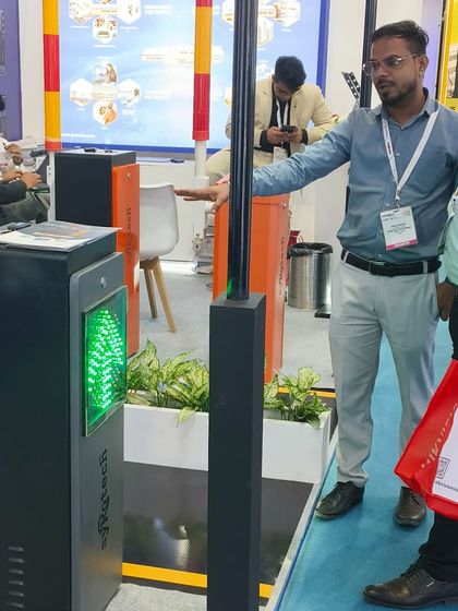 Our team demonstrating our smart parking barrier with an integrated LED display to an interested visitor at Traffic Infratech 2024.
