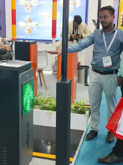 Our team demonstrating our smart parking barrier with an integrated LED display to an interested visitor at Traffic Infratech 2024.