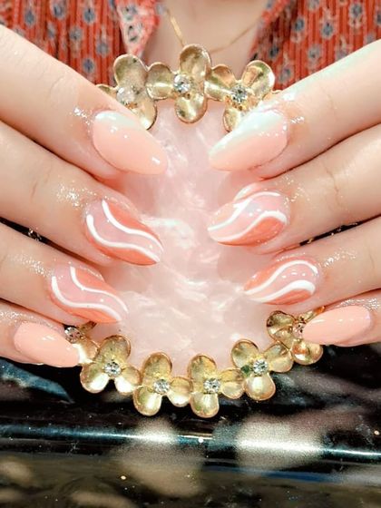 A peachy ombre set with abstract white waves for a modern and artistic design.