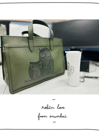Diksha's Robin tote with a custom Gond art owl motif at her desk in Mumbai. A work bag that's anything but boring.