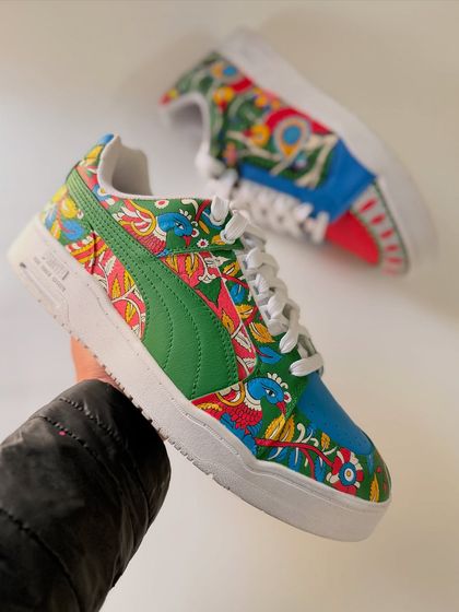 This shot highlights the Madhubani-inspired side of the custom Puma sneakers. The bright colours and folk-style patterns are characteristic of this beautiful art form from Bihar.