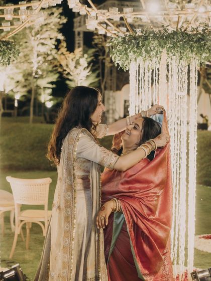 A tender moment between the bride and her sister-in-law. We see styling as a way to honor the new relationships being formed through the wedding.
