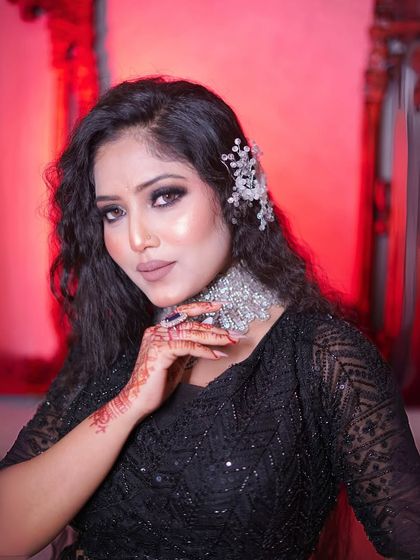 A dramatic, red-lit portrait that adds a touch of high-fashion to the look.