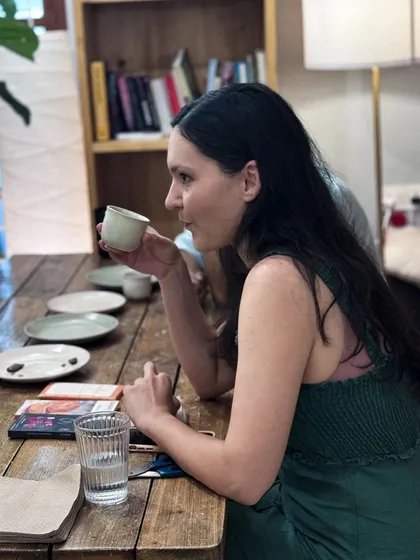 A participant savoring the complex flavors of a coffee and chocolate pairing. These workshops are a great way to refine your palate.