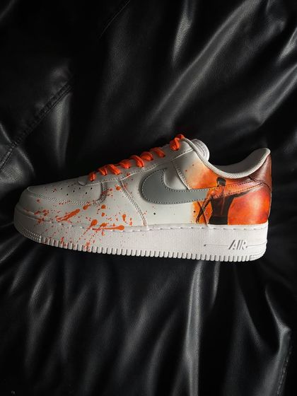 A side profile of the orange-themed "Salaar" custom sneaker.