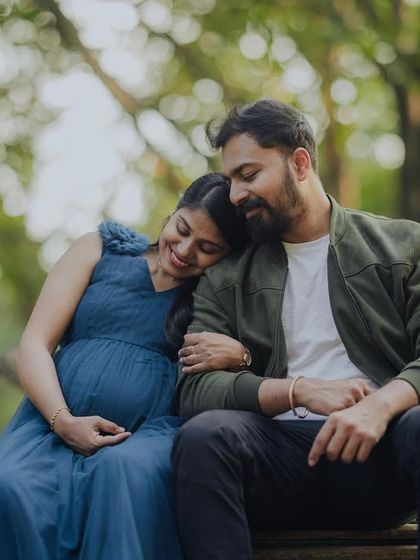 A peaceful portrait of togetherness. Seated on a wooden bridge, this shot captures a quiet, shared moment as the couple looks forward to their new journey.