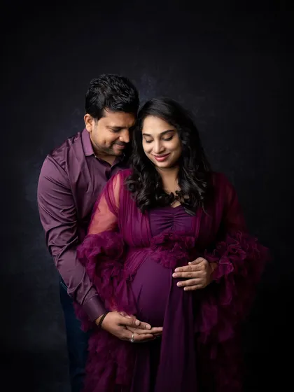 Another angle from the purple gown maternity session, showing the couple in a gentle embrace. My goal is to provide a variety of poses so you have many beautiful options to choose from.
