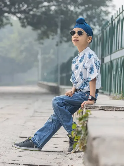 A relaxed and cool portrait of a young boy enjoying a quiet moment during his outdoor session.