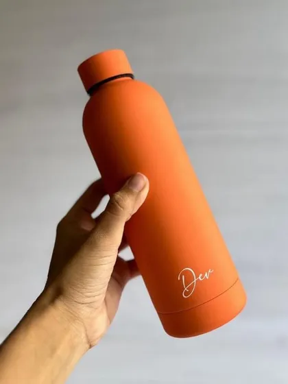A bright orange matte Aqua-lite bottle, perfect for adding a pop of color to your day. All our bottles are leak proof and durable.