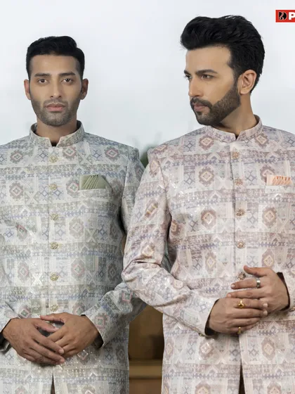Here you can see two variations of my printed Jodhpuri jackets, one in a lighter tone and one with warmer accents. This shows how the same style can create different moods, perfect for a groom and groomsman duo.