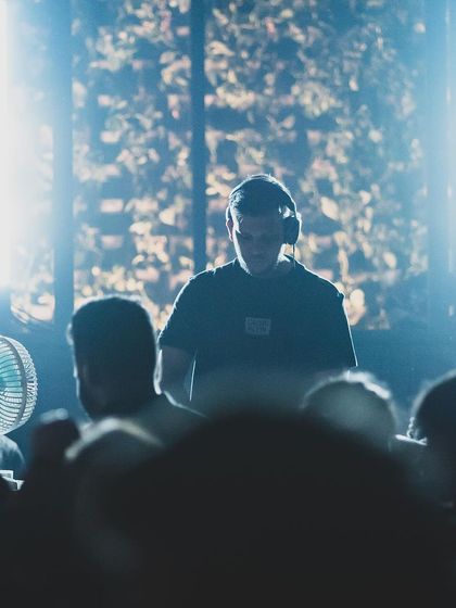 An artistic shot of me at Raahi, backlit and surrounded by the crowd. This captures the cool, focused vibe of a great club night.