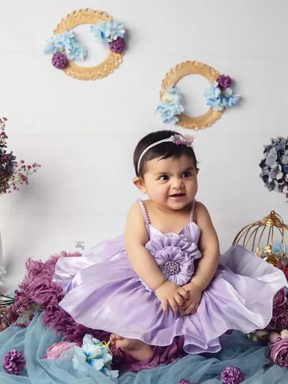 A candid moment from the lavender floral shoot. Her sweet side-glance and happy expression make for a charming and natural portrait.