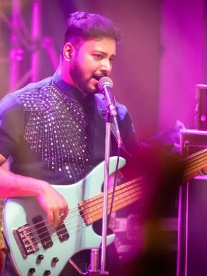 Our bassist, smiling as he plays, enjoying the incredible vibe of the college fest.