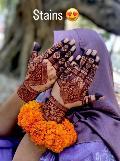The stain is everything! This photo shows the beautiful dark color of the mehndi after a day, set against a natural background.