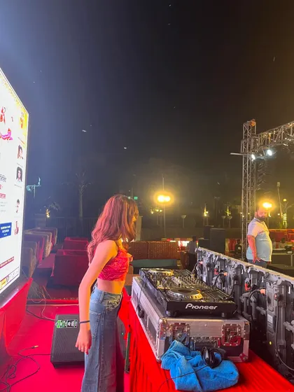Another angle from the Dandiya night, showing my Pioneer DJ console and the stage setup.