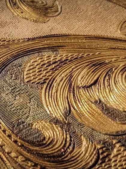A close-up of one of my most luxurious wallpapers, featuring a rich, gold damask pattern with deep, intricate embossing. This design is perfect for creating a statement of opulence and timeless artistry in any room.