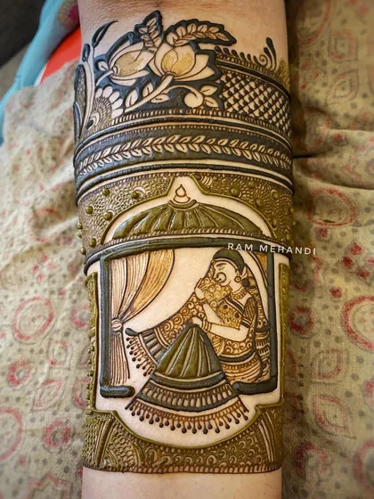 A detailed view of the embossed bridal portrait, showing the intricate patterns surrounding the central figure. The lotus motifs at the top add a touch of traditional elegance.