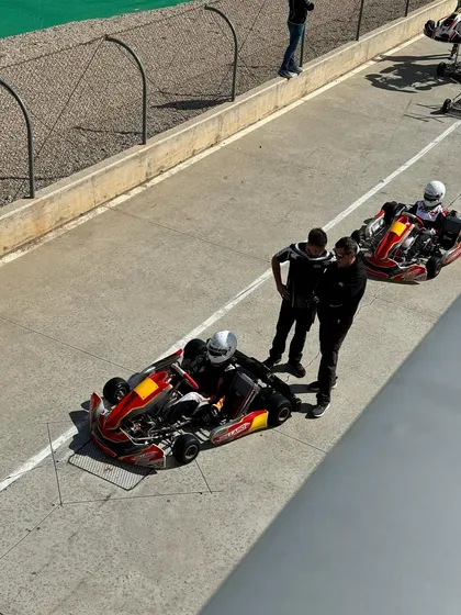 A duplicate shot of our driver and his team in the pit lane.