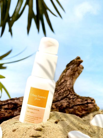 I created a mini beach scene with sand, driftwood, and a sky backdrop to showcase this sunscreen. This creative setup instantly communicates the product's purpose for sun protection in a fun, visual way.