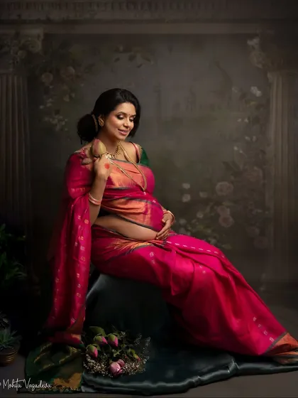 A seated portrait in a stunning pink silk saree. The pose is full of grace, and the rich fabric drapes so beautifully.